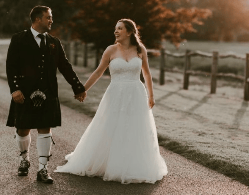 A bride and her husband on her wedding day after doing a bride to be workout programme